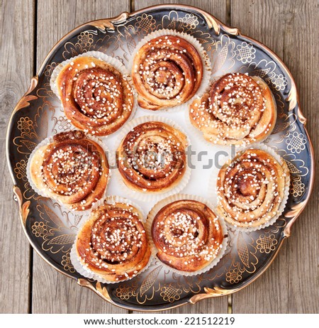 Freshly baked homemade Swedish cinnamon buns with pearl sugar on top
