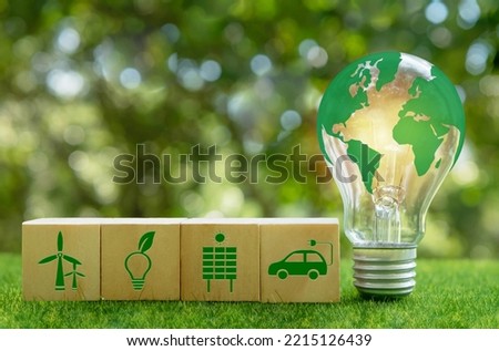 Renewable Energy, sustainable development. The green world map is on a light bulb with icons energy sources for renewable, sustainable development. Ecology concept.