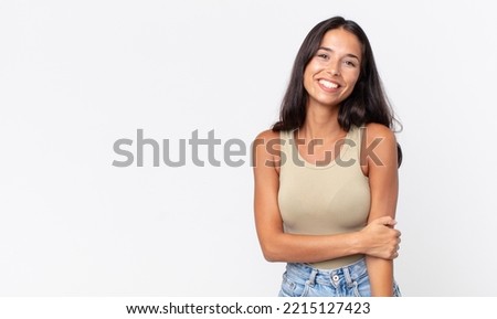 pretty thin hispanic woman laughing shyly and cheerfully