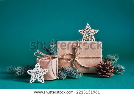 Christmas sustainable gift boxes composition with natural decor on blue green background. Christmas zero waste, boxing day and winter holiday Royalty-Free Stock Photo #2215131961
