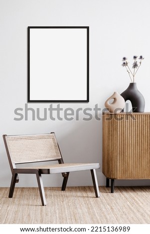 Blank picture frame mockup on a wall. Portrait orientation. Artwork template in interior design
