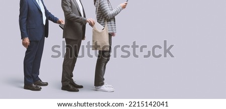 Thief stealing a woman's purse and being robbed by another thief Royalty-Free Stock Photo #2215142041