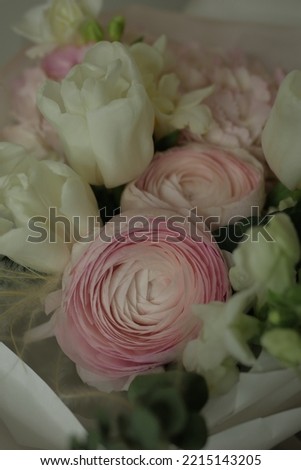 girly, cute, tender, beautiful bouquet. green, white and pink flowers. tulip, ranunculus, hydrangea, eucalyptus branches
