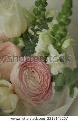 girly, cute, tender, beautiful bouquet. green, white and pink flowers. tulip, ranunculus, hydrangea, eucalyptus branches
