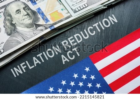 USA flag, dollars and inscription inflation reduction act. Royalty-Free Stock Photo #2215145821