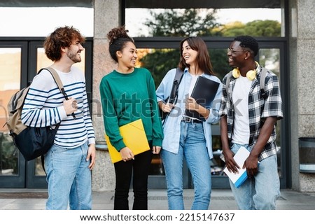 Happy University student friends talking sharing good times together at the Campus Staircase entrance Royalty-Free Stock Photo #2215147637