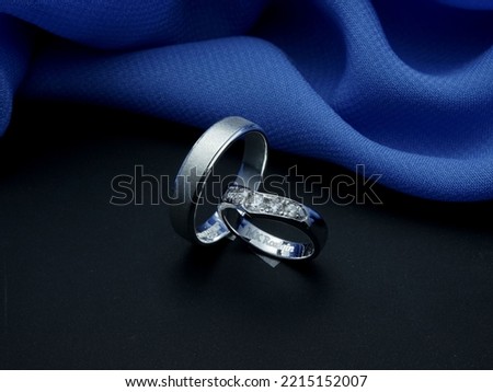 White gold wedding ring. couple ring with glossy and doff finishing with blue and black background