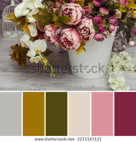 Paper and textile artificial flowers in a decorative bouquet. The interior decoration of a photo studio is shot in natural light during the day. Autumn colors. Color palette for design. 