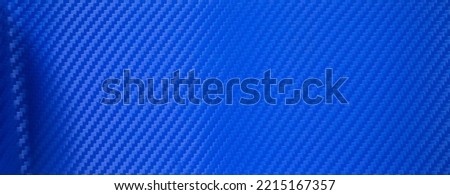 Rectangular background made of blue carbon film. Blue carbon fiber. The shape of the banner is made of sports material. Car interior tuning.