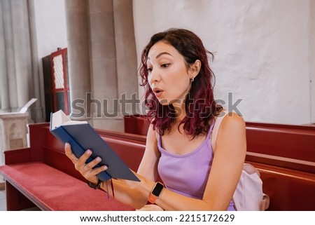 Woman singing and reading Gospel Songbooks in church. Leisure and religious education