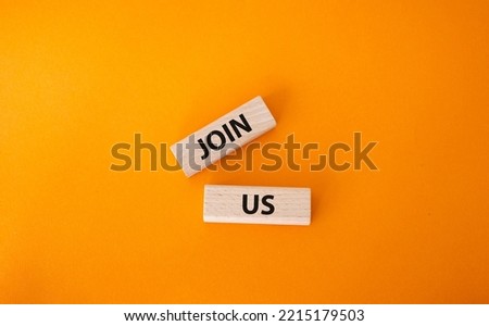 Join us symbol. Concept word Join us on wooden blocks. Beautiful orange background. Business and Join us concept. Copy space