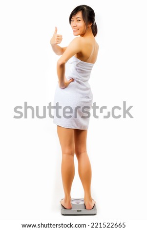asian woman feet on scales in white background