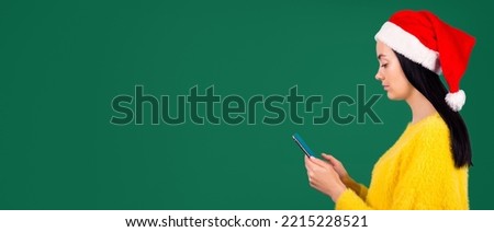 Profile side view photo of cute sweet youth teen teenager hold hand device modern technology search information look news feed dressed yellow fluffy sweater isolated green background