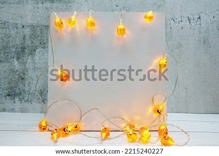 Halloween Holiday Background with LED pumpkin Decoration on wooden background