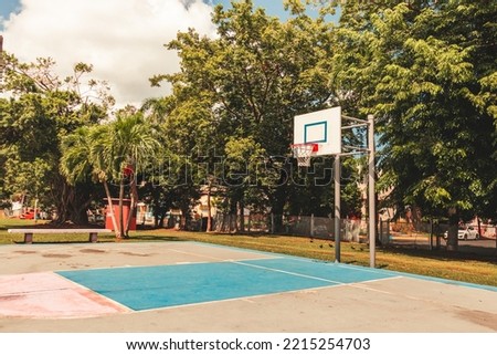 Simple street urban basketball court portrait from "parque la merced" puerto rico in the evening.
