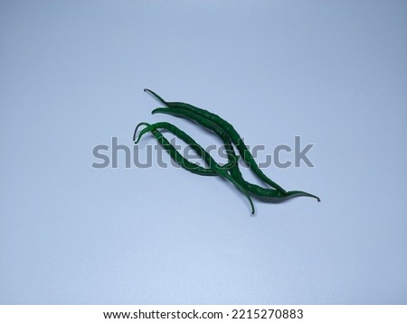 Fresh green chili pepper isolated on a white background