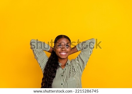 Photo of impressed millennial brunette lady palms head look up wear striped shirt isolated on yellow color background