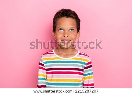 Photo portrait of little hispanic boy looking up empty space shopping promo wear stylish striped clothes isolated on pink color background Royalty-Free Stock Photo #2215287207