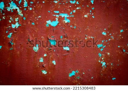 Background texture of flaky paint. Abstract texture of old red paint on a metal surface. Royalty-Free Stock Photo #2215308483