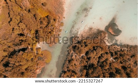Aerial view of Klagenfurt lake and river in autumn, Austria.