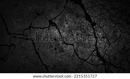 Black white old wall texture. Cracked rough concrete plate. Close-up. Dark gray grunge background for design. Distressed, broken, damaged, crumbled surface. Spooky, creepy, horror concept. Halloween.