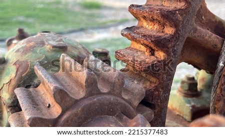Gears of a disused machine, two rusty cogwheels that fit together