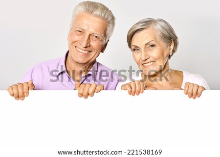 Happy old couple on a white background