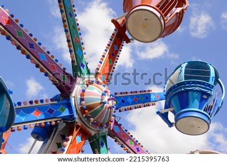 Vintage Luna park, old school rides. Carousel, children's train, parachutes, amusement park. Bright picture - vacation with children. A place for text. Royalty-Free Stock Photo #2215395763