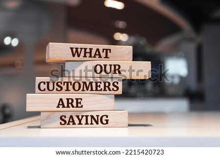 Wooden blocks with words 'What Our Customers are Saying'. Royalty-Free Stock Photo #2215420723