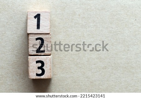 Order of priorities. 1,2,3 numbers arranged from wooden letters. Royalty-Free Stock Photo #2215423141