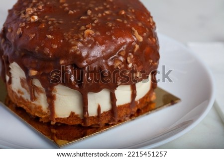 German Berliner Chocolate Cake With Banana on a White Plate