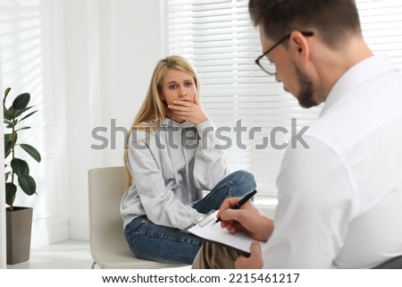 Psychotherapist working with drug addicted young woman indoors Royalty-Free Stock Photo #2215461217
