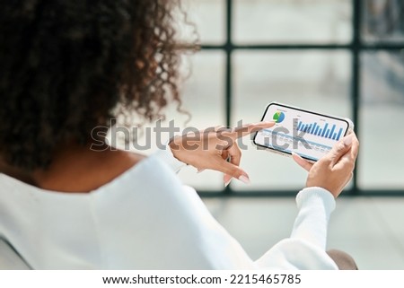 business woman analyzing the chart of the cryptocurrency exchange rate. Royalty-Free Stock Photo #2215465785
