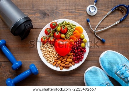 Cholesterol diet concept with Less fat food in plate with heart object Royalty-Free Stock Photo #2215492657