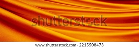Orange silk satin curtain. Bright luxury background. Design. Shiny golden draped fabric, folds. Wavy lines. Flowing. Liquid, ripple. Valentine, Mother's day, festive. Banner. Wide. Long. Panoramic. Royalty-Free Stock Photo #2215508473