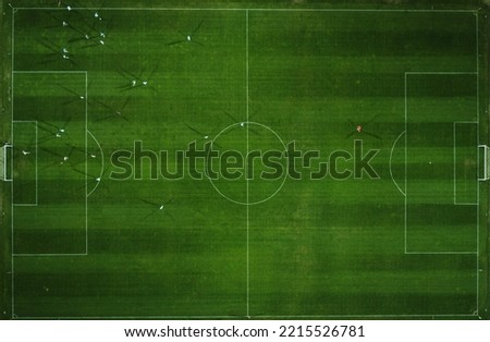Aerial view of a football match, soccer. Football field and Footballers from drone