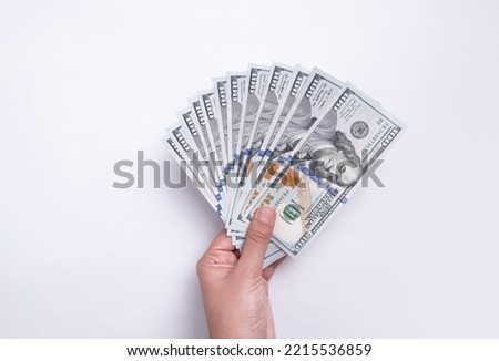 beyaz bir arka plan üzerinde izole dolar ile kadın eli Royalty-Free Stock Photo #2215536859