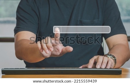 Hand of man touching searching browsing icon for internet data information networking. The blank search bar screen background, business and technology, web banner,search engine concept.