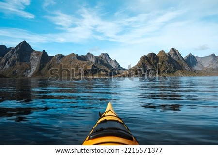 Kayaking in the most beautiful place in Norway. Lofoten islands. Reine. Royalty-Free Stock Photo #2215571377