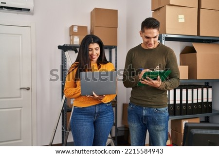 Man and woman ecommerce business workers working at ecommerce office