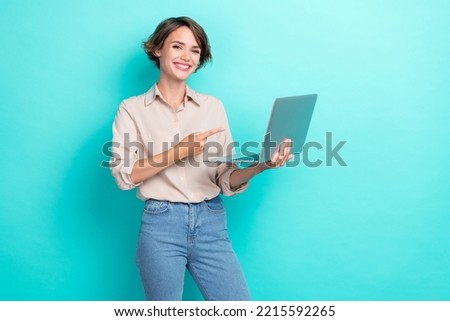 Photo of young charming nice woman wear business outfit finger directing advertisement new development it company isolated on aquamarine color background