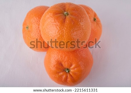 Beautiful bright tangerines on a white background