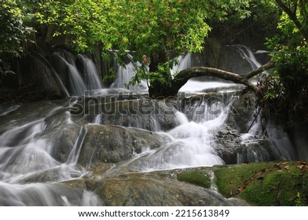 Wang Kan Lueang waterfall is a spectacular beautiful limestone waterfall in Lopburi province. Namtok Wang Kan Lueang Arboretum ,Thailand