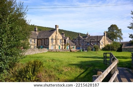 Stone houses of the small traditional rural village of Blanchland on a sunny autumn day in Northumberland on the border of County Durham, England, UK. Royalty-Free Stock Photo #2215628187