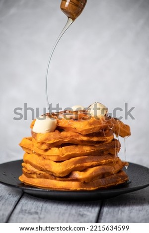 food photography in a high key pumpkin waffles and honey