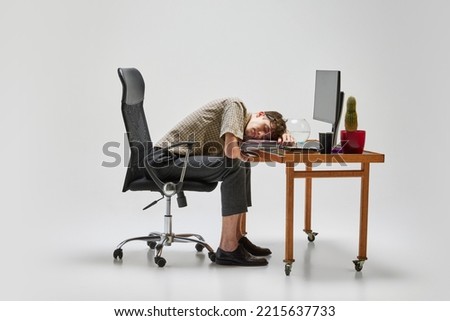Napping. Young man, student sitting at computer desk and sleeping after hard day. Business, studying, home education, youth, remote workplace concept.Copy space for text