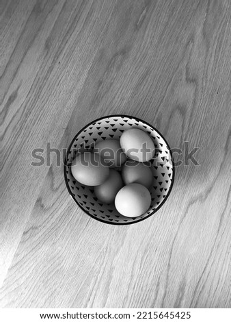 Noir Eggs on wooden table 