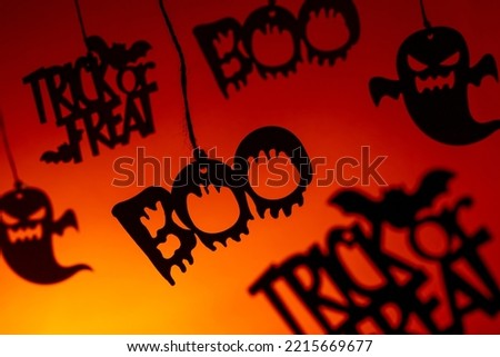 Chinese shadows allusive to halloween with a vibrant orange background, Braga, Portugal.