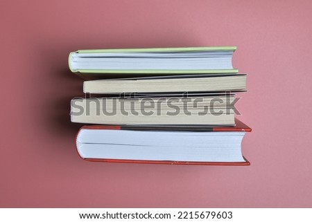 Macro photography of books on pink background