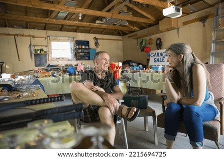 Couple talking at garage sale